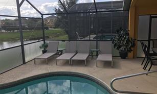 4 sun beds on patio